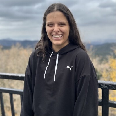 A photo of Jo. They are smiling.